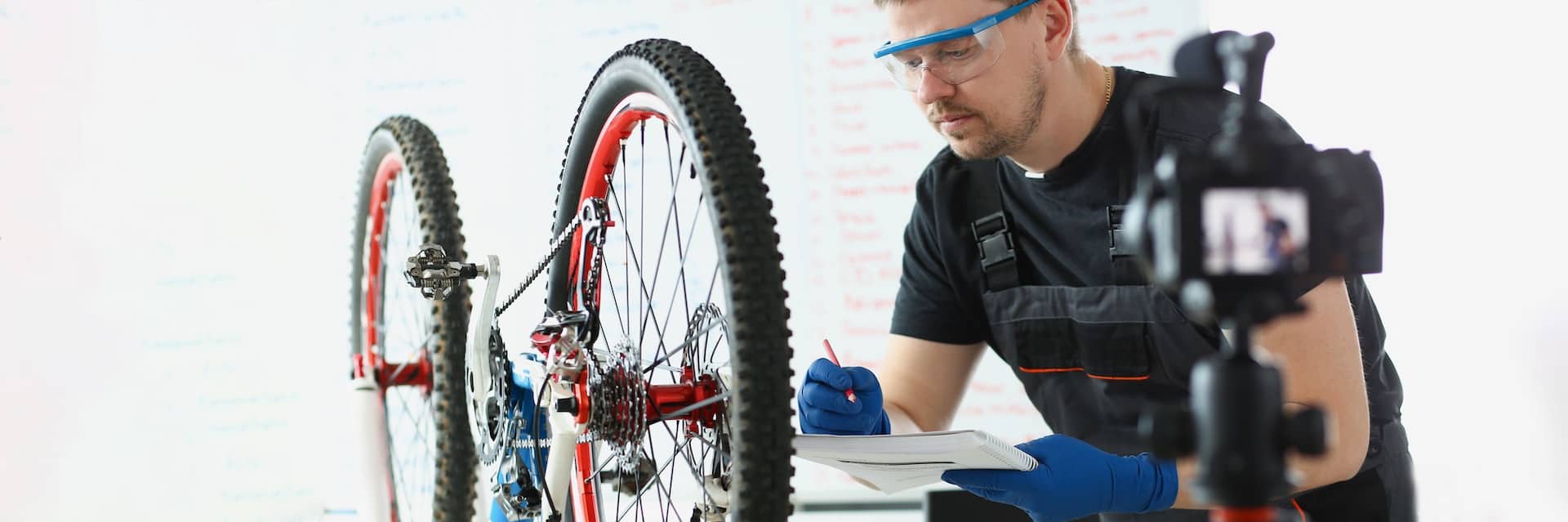 concentrated middle aged mechanic writing down needed details to repair vehicle